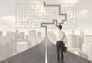 47755850 - businessman looking at road with maze and solution concept